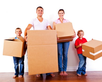 Loading furniture into a van for a flat move in North London