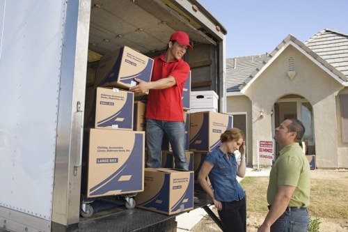 Family home moving preparation with labelled boxes and packing supplies