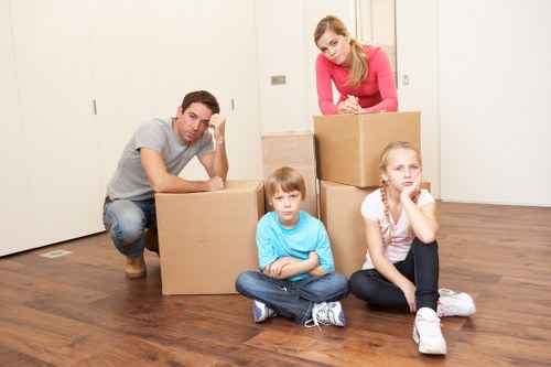Professional removalists loading household items carefully