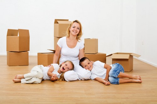 Unpacking boxes in a Finsbury Park flat after moving day